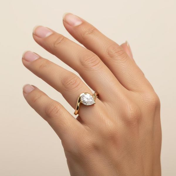 Pear CZ Solitaire on Wavy Band